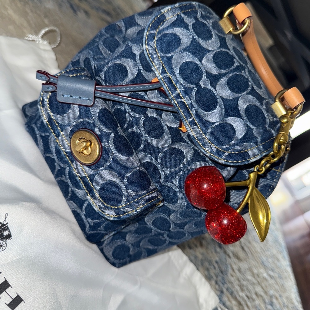 Coach Blue Denim Riya Signature Backpack with Red Cherry Charm